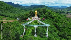 Aerial view of the Pra Yai Phu Khok Ngio or Chiang Khan Skywalk, Loei Province's newest landmark, overlooking the Hueang River flowing through to meet the Mekong River.