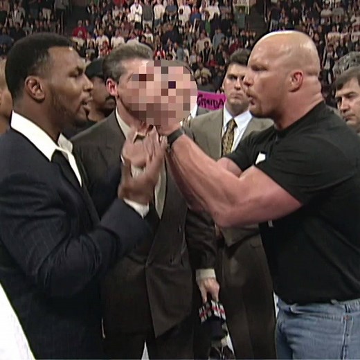 "I've always got a little bit of 'sign language,' so here's to ya!" 😳😱💀 Stone Cold Steve Austin and Mike Tyson had to be restrained 23 years ago today on WWE Raw! | WWE Network