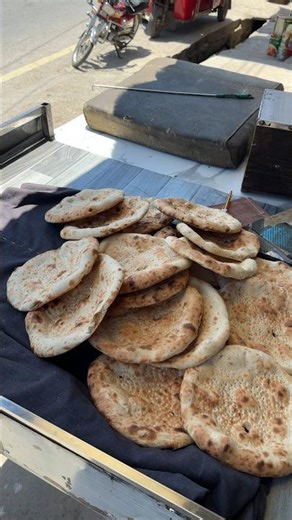 Golden crispy breads baking inside fiery traditional clay oven #FoodPorn #FreshBread #ViralFood #Fyp