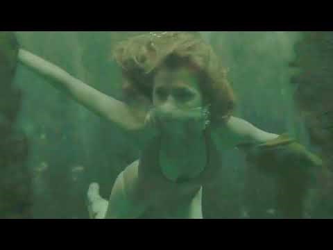 Clémence Poésy One-Piece Silver Swimsuit Underwater Scene
