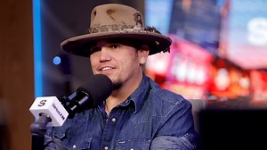 Country singer Bryan Martin apologizes to fans after he was removed from the stage mid-performance