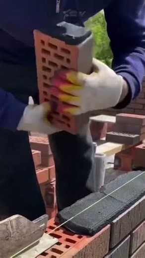 Use a cement trowel to level the mixture with a plaster bat to make a wall #shortvideo #construction
