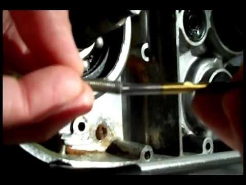 Using a left hand drill bit to remove a buggered screw