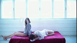 Couple in love. Romantic couple in bed enjoying sensual foreplay. Beautiful couple lying together on the bed.