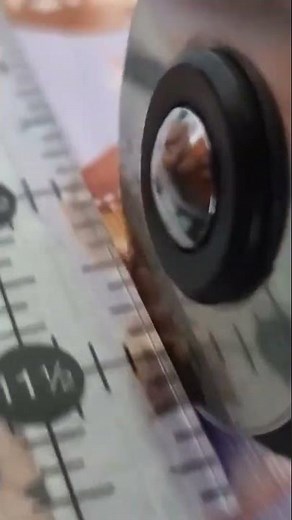 using rotary cutter to cut the fabric