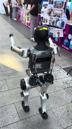 Chinese Robot Look2: Chinese Robot NOETIX is walking on the street