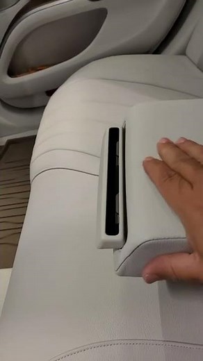 Mercedes EQs rear cupholder demonstration.