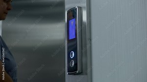 Close up shot of nurse in uniform coming to elevator door and pressing call button. Health care specialists at work in modern hospital. Medical worker uses elevator in working process. Static shot.