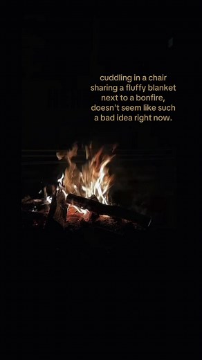 Cuddling in a Chair Under a Blanket Next to a Bonfire