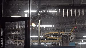 Newspaper production lines seen through a window