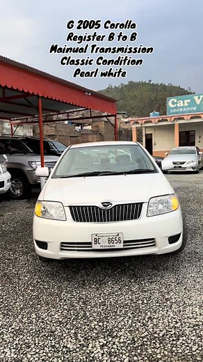 2005 Toyota Corolla Review: Classic Pearl White Sedan