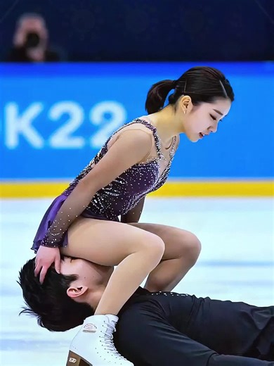 Ice Skating Couple: Grace and Skill of Stepanova & Bukin