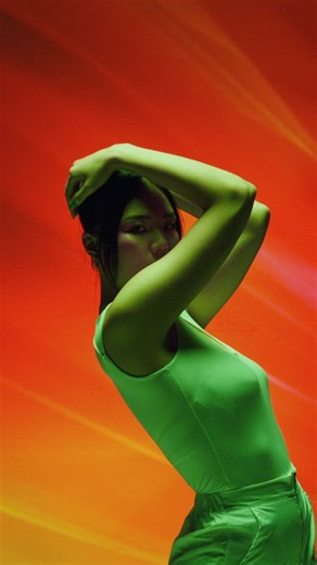 Conceptual performance of a dancer on a colorful background - Free Stock Video