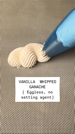 The best recipe for the best ganache on the Internet! Whipped Vanilla Ganache (Eggless, 4 ingredients)200g white chocolate355ml heavy whipping cream (divided)1 tsp vanilla extract1 vanilla pod, scrapedHeat 200ml cream with vanilla pod seeds. Simmer, then let infuse 10–15 mins. Reheat and pour over chopped chocolate. Let sit 1–2 mins, stir until smooth. Add extract cold 155ml cream. Mix, then chill 4 hrs (or overnight). Whip till soft-medium peaks. Light, airy & full of real vanilla flavor—perfec