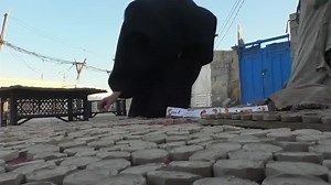 Generations of families make clay tablets in Iraq city