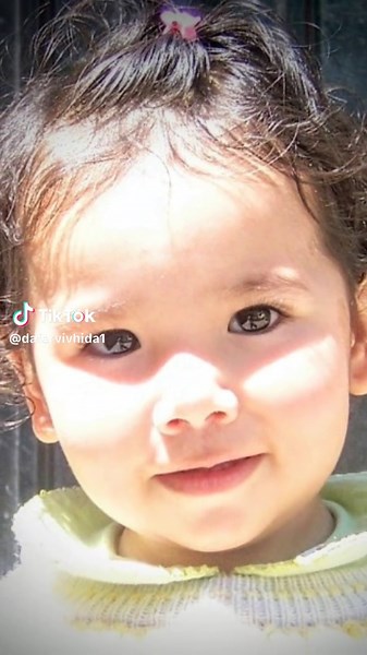 Stunning Red Dress: A Young Girl's Elegant Pose