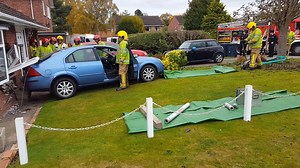 9.4K views · 29 reactions | WATCH: Here's the scene on Primrose Drive in Shrewsbury after a car reversed into a house. No-one's hurt, but a woman sitting on the sofa behind the window was treated for shock. | BBC Shropshire | Facebook