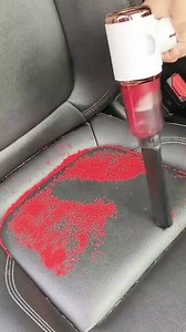 suck up all the scattered red seeds using a vacuum cleaner that can suck up all of them