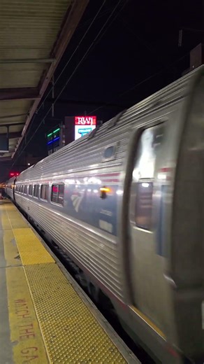 Amtrak Acela blows by while Amtrak ACS-64 #633 arrives at New Brunswick train station