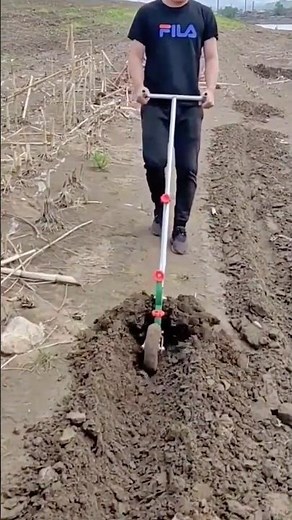 Preparing Farmland by Making Furrows Using a Manual Hand Plow Tool