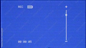The screen of a VHS VCR recorder showing a full blinking battery symbol. Blue background. Use: overlay or key. With the typical noise and distortion of the era.