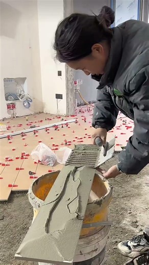 Woman Tiling a Floor Like a Pro #craftsmanship #construction