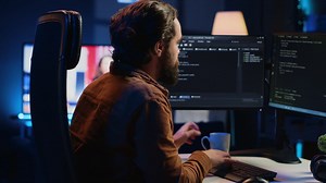 Premium stock video - It specialist brainstorming ways of solving database errors, working hard