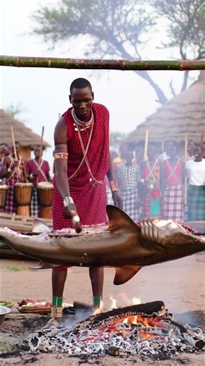 Tribe man BBQ a WHOLE SHARK for TRIBAL feast. #tribepeople #tribalculture #africanlife #tribalfood