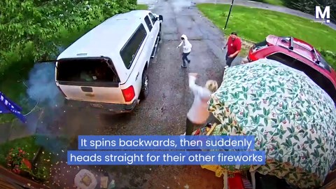 Pinwheel sparkler spins straight into pile of fireworks, exploding right in front of family