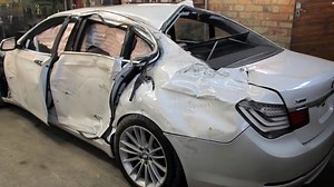 Russian Auto Body Mechanic Demonstrates How He Completely Restored a Totaled BMW 7 Series Sedan