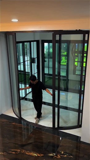 SONNE - The Aluminium Atelier on Instagram: "Introducing our Curved Sliding Door — designed to move with grace and built with precision. Custom-curved frame, engineered rails, and flawless motion deliver a statement of luxury and individuality. A signature piece for homes that value exceptional design and refined execution. Discover the difference with SONNE. SONNE: Safe, Sooundproof and Seamless ☎ +62 821-2873-9988 (Office WhatsApp)⁠ 📧 marketing@sonnealuminium.com ⁠ 📍 SONNE Aluminium - Jl. Ra