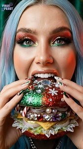 3.3K views · 1.1K reactions | This one was never meant to be neat. I bite into a Christmas candy burger stacked way too high sugared bun, jewel candies, crunch, cream, and that sticky holiday sweetness that gets everywhere. Messy fingers, sparkling teeth, zero regrets. Some burgers are for balance. This one is for the holidays. ✨ #oddlysatisfying #fantasyasmr #christmastreat #fantasyfood #asmreats | Faux Feast | Facebook