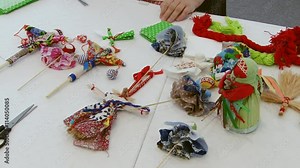 Making many Russian handcrafted souvenirs toy nesting dolls on the table. Traditional Russian crafts.