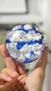 ☁️💙Demolding time for this little resin blue sky & cloud sphere project. We put the clouds made with white light clay, and bird stickers inside, and pour them with epoxy resin. 👋We love this magic process, anyone else here? Find the resin supplies in the comment area. #letsresin #epoxyresin #resinart #resinsphere #demoldingvideo #demoldingtime #resincrafts #demoldingresin | Let's Resin