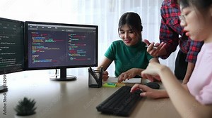 Slow motion back end software developer engineer for computer programming working together on debugging writing computing code, solving complex algorithms display on monitor in office. Burgeoning Stock Video