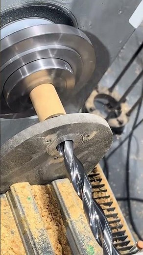 Automatic feeding of short material through holes, drilling of long holes, and external threading