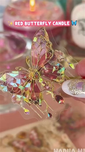 Frangenanc on Instagram: "A candle that feels like magic! This butterfly soy candle DIY combines cozy soy wax with delicate flowers, pearls, and a dreamy butterfly design. Relaxing ASMR sounds + cozy aesthetic = pure handmade bliss. #instalike Would you burn it or keep it as decor? #asmr #diy #cozyvibes #candles #candlemaking #handmade #craft #viralreels #trendingreels"