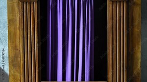 Typical old wooden confession booth at a church, with blue curtains.