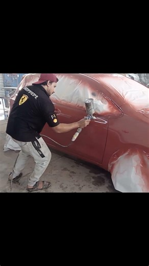 spraying clear coat on a car