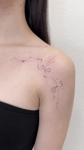 Flowy Ribbon Tattoo: A Cute and Girly Design