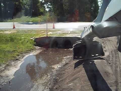 Gradall building a ditch