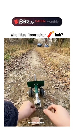 Films | Movies | Tv series on Instagram: "The post shares a 29-second video of hands assembling and igniting a DIY toy cart propelled by firecrackers, which bursts forward amid smoke on a rural dirt path, drawing 92,000 views and 332 likes for its inventive fun. User @moondcgcgk , with bio "Give me some good news," frequently posts similar short clips of whimsical inventions and cute moments, building a following through feel-good, shareable content. The setup demonstrates Newton's third law thr