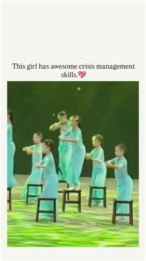 @everythingexplain_ | The video captures a young performer in a synchronised Chinese chair dance at a Chengdu competition, where her stool suddenly breaks,... | Instagram