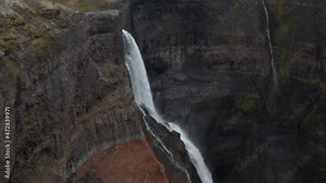 Aerial view of Haifoss and Granni waterfall in Iceland. Drone view of two jets of water crashing against the rocks and transformed into water dust. Waterfall on the Fossa river