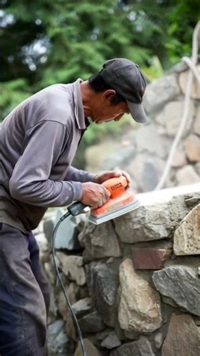 The process of smoothing river stones using automatic sandpaper is easy #shorts