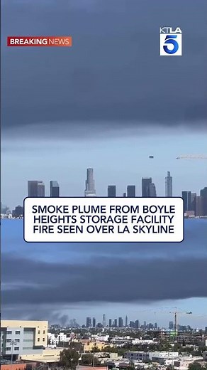 Smoke plume from Boyle Heights storage facility fire seen over LA skyline