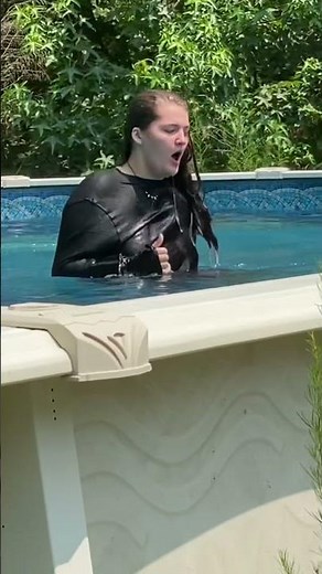 Jumping in pool fully clothed