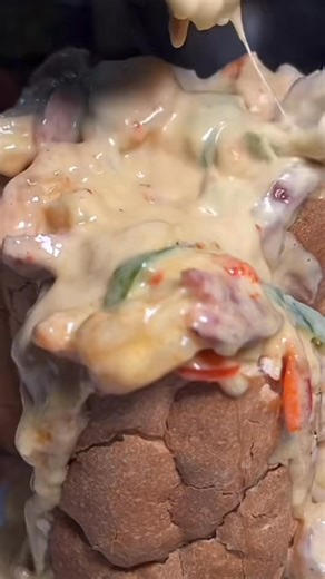 Cajun Kevin Po Boy: Gulf Shrimp, Louisiana Crawfish Tails, Colossal Lump Crab Meat, Smoked Sausage with Red and Green Bell Peppers cooked in a Parmesan Cream Reduction served in Toasted French Bread brushed in a Garlic Butter #shrimp #colossalcrab #crawfish #sausage #parmesan #poboy #cajunkevin #littlebigcup #arnaudville #eat #bayou #hungry | The Little Big Cup