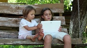 Two Sisters Tablet Pc Sits On Stock Footage Video (100% Royalty-free) 12399839 | Shutterstock