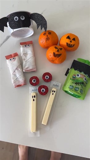 6 Super Easy, Spooky Packaged Snack Ideas for Class Parties 🎃👻👹 We’re not the most Pinteresty moms but we do love a cute themed snack! These Halloween munchies are perfect for class parties when packaged snacks are required AND they’re a breeze to put together. 1. Mummy bars! 👀 Simply wrap your favorite snack bar in white medical tape and add googly eyes. 2. Bat cups 🦇 Draw and cut out wings and an oval face from black construction paper, then tape on your favorite pudding or yogurt cup. Ad